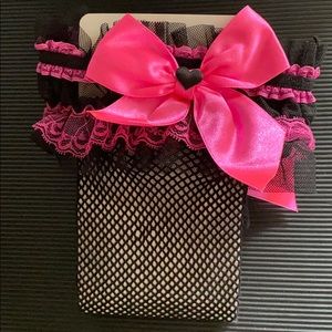 Thigh high fishnet tights black with pink bow.
